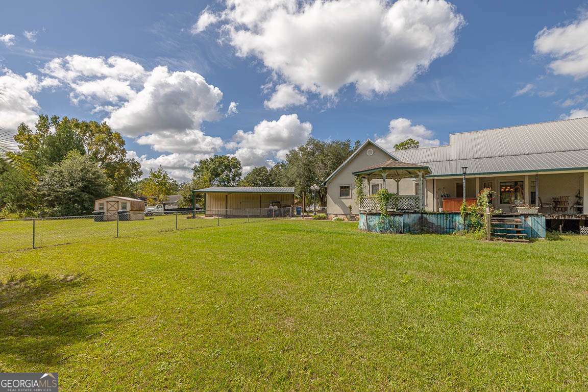 220 Chickasaw Road Hoboken, GA 31542 - Photo 30 of 55 a front view of house with yard and swimming pool