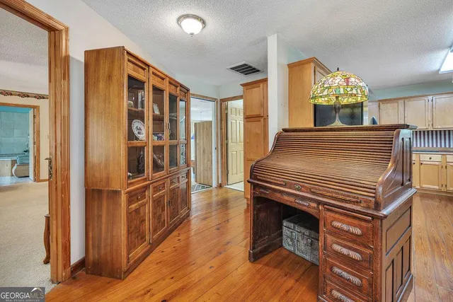 a bed room with a bed and a chair