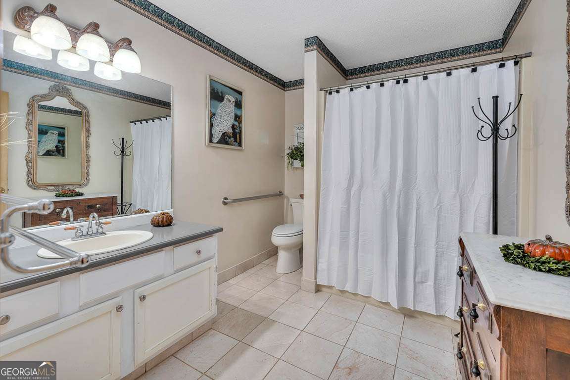 220 Chickasaw Road Hoboken, GA 31542 - Photo 44 of 55 a spacious bathroom with a double vanity sink mirror and toilet