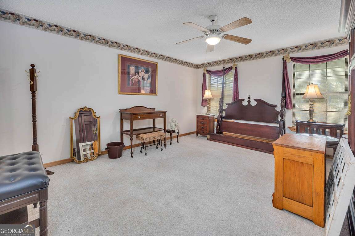 220 Chickasaw Road Hoboken, GA 31542 - Photo 45 of 55 a living room with furniture and a chandelier