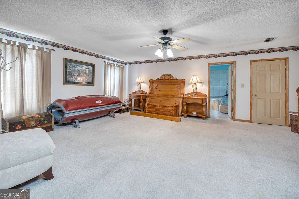 220 Chickasaw Road Hoboken, GA 31542 - Photo 46 of 55 a bed room with a bed and a chair