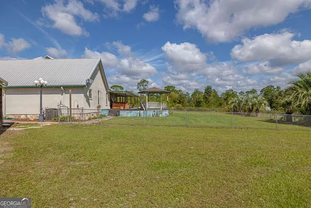 a view of an swimming pool and an outdoor space