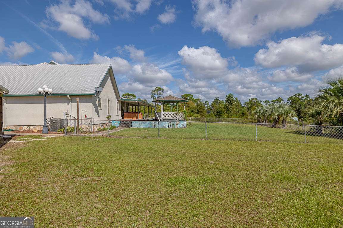 220 Chickasaw Road Hoboken, GA 31542 - Photo 6 of 55 a view of an swimming pool and an outdoor space