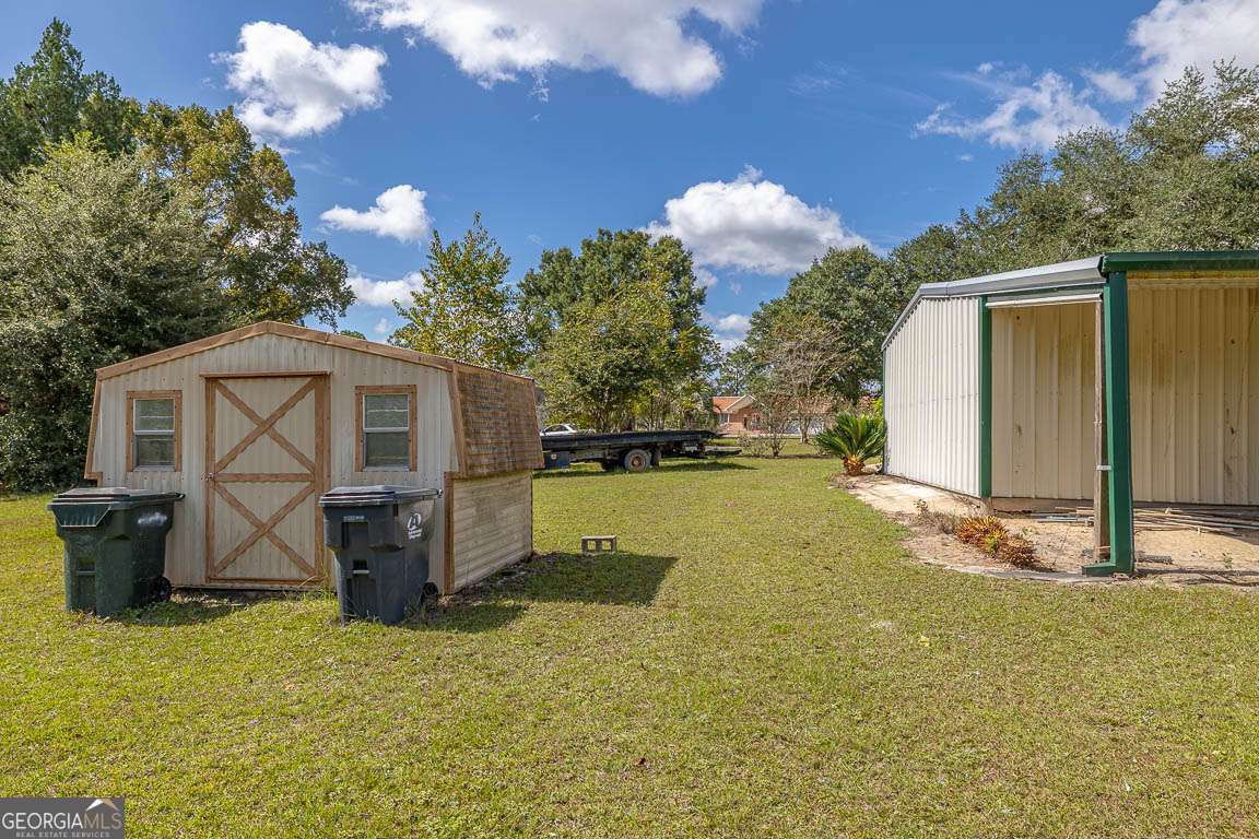 220 Chickasaw Road Hoboken, GA 31542 - Photo 9 of 55 a view of a house with backyard