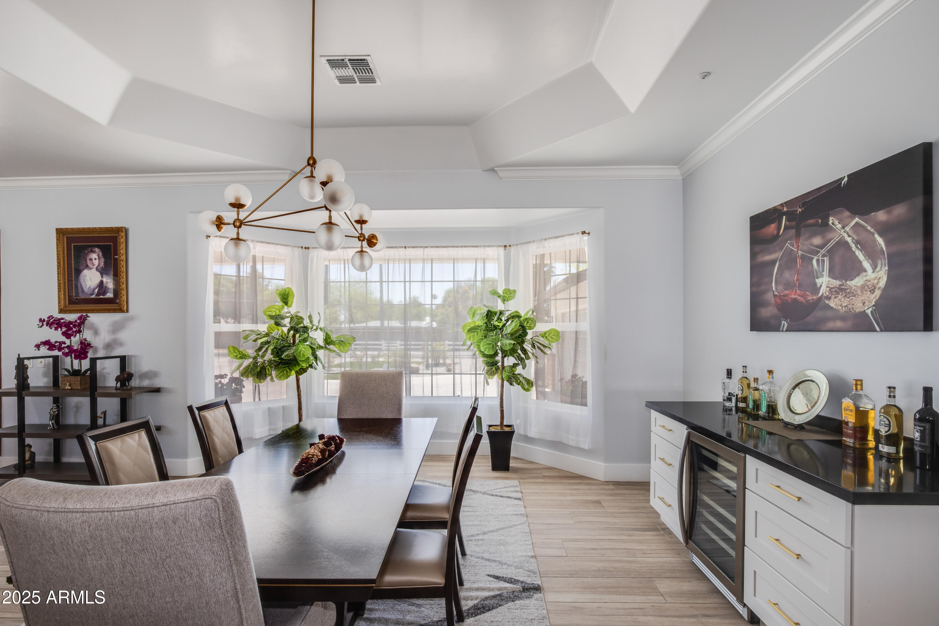 516 West Rancho Drive Phoenix, AZ 85013 - Photo 11 of 46 a dining room with furniture potted plants and wooden floor