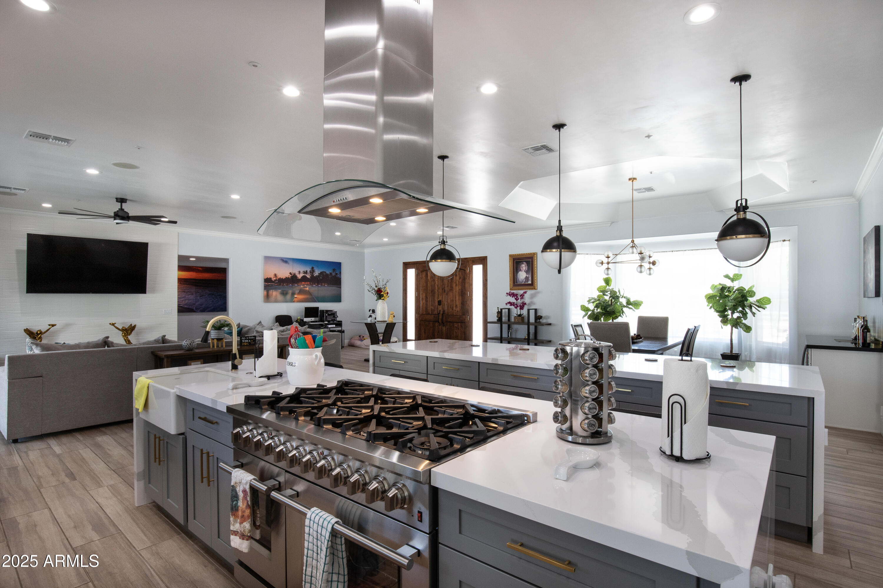 516 West Rancho Drive Phoenix, AZ 85013 - Photo 15 of 46 a kitchen with stainless steel appliances granite countertop a stove and a view of living room