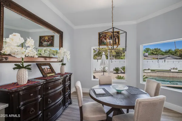a dining room with furniture and window