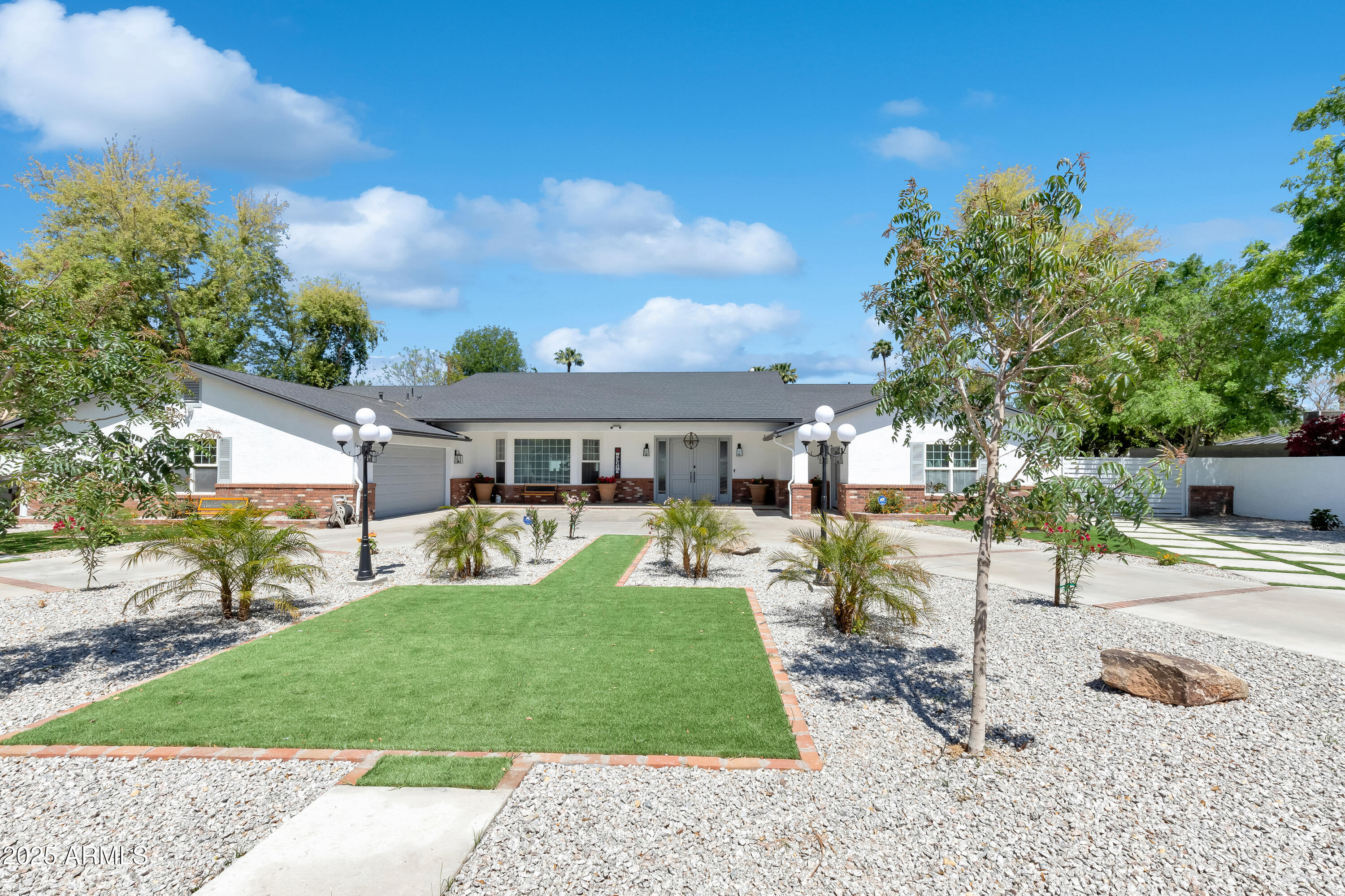 516 West Rancho Drive Phoenix, AZ 85013 - Photo 2 of 46 a front view of a house with garden