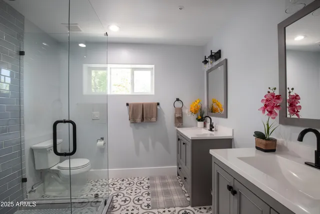 a bathroom with a sink toilet and mirror