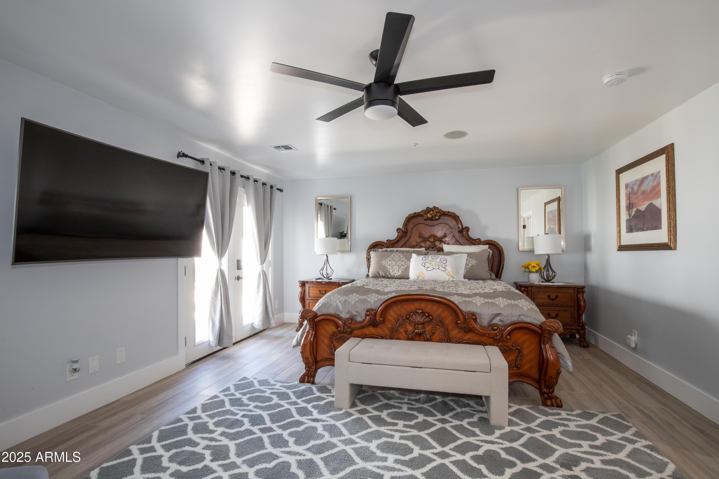 516 West Rancho Drive Phoenix, AZ 85013 - Photo 24 of 46 a bedroom with a bed and a flat screen tv