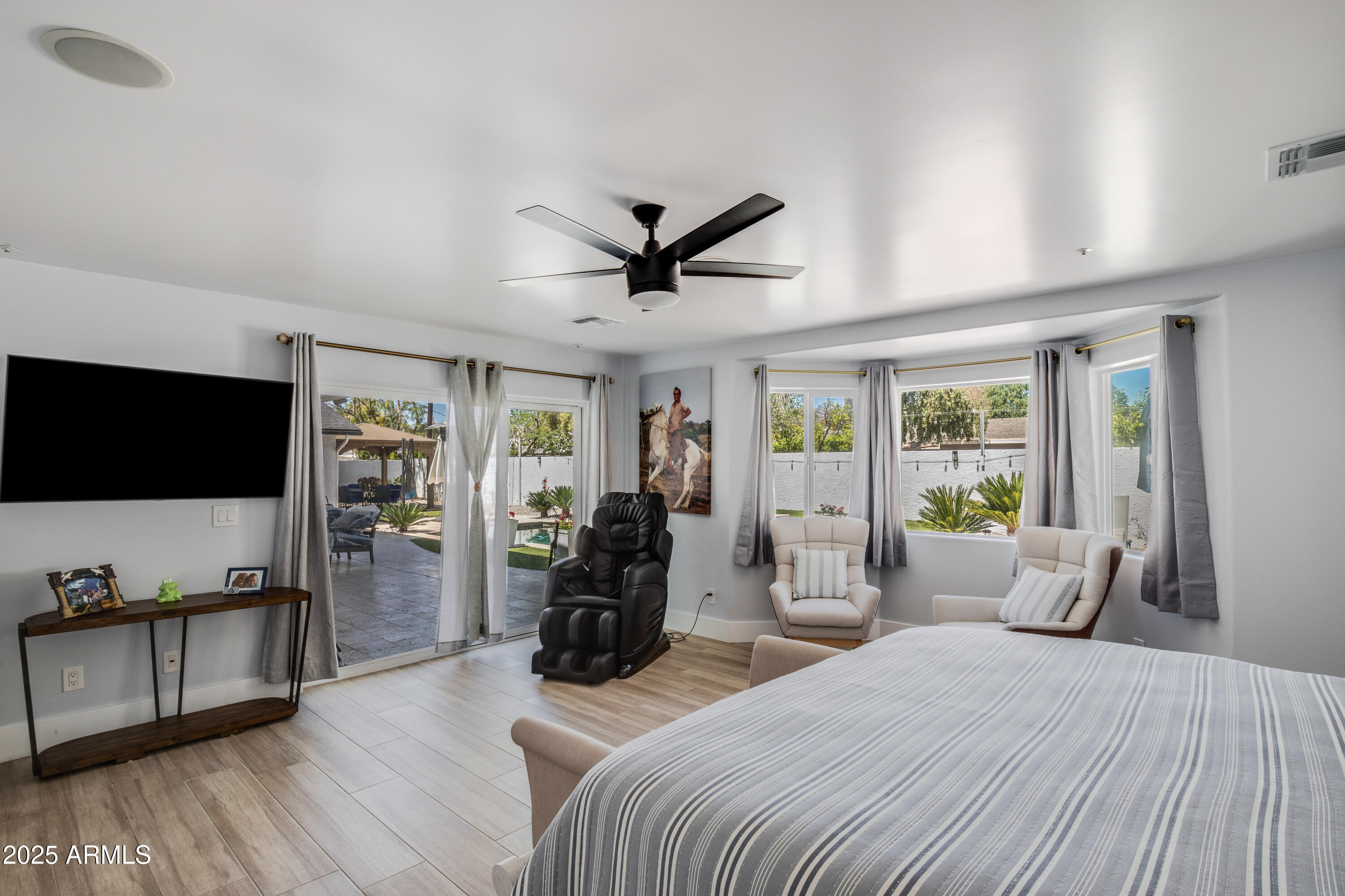 516 West Rancho Drive Phoenix, AZ 85013 - Photo 27 of 46 a bedroom with furniture and a flat screen tv