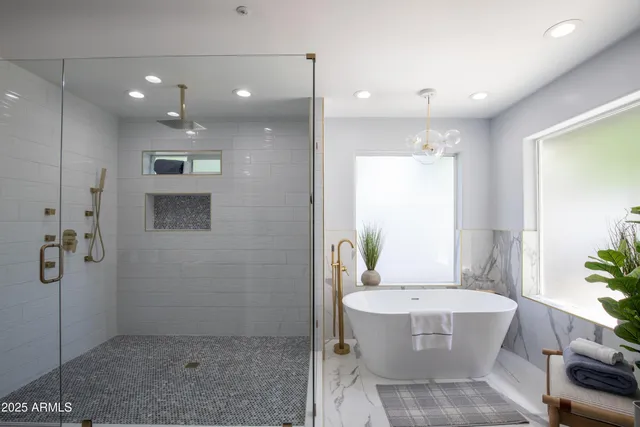 a bathroom with a bathtub and shower