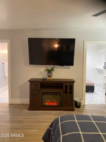 a living room with a flat screen tv and a fireplace