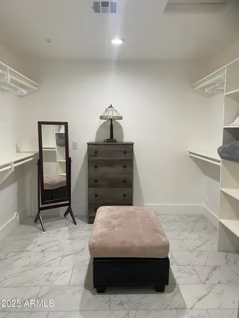 a bedroom with a bed and cabinets
