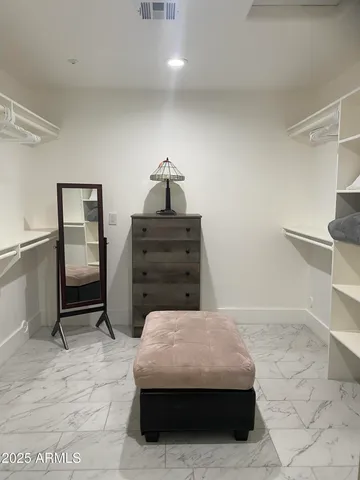 a bedroom with a bed and cabinets