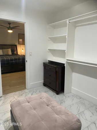 a room with a dresser and a mirror