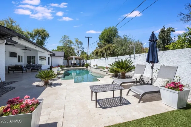 a view of a chairs and table in the patio