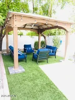 a view of yard with a table and chairs