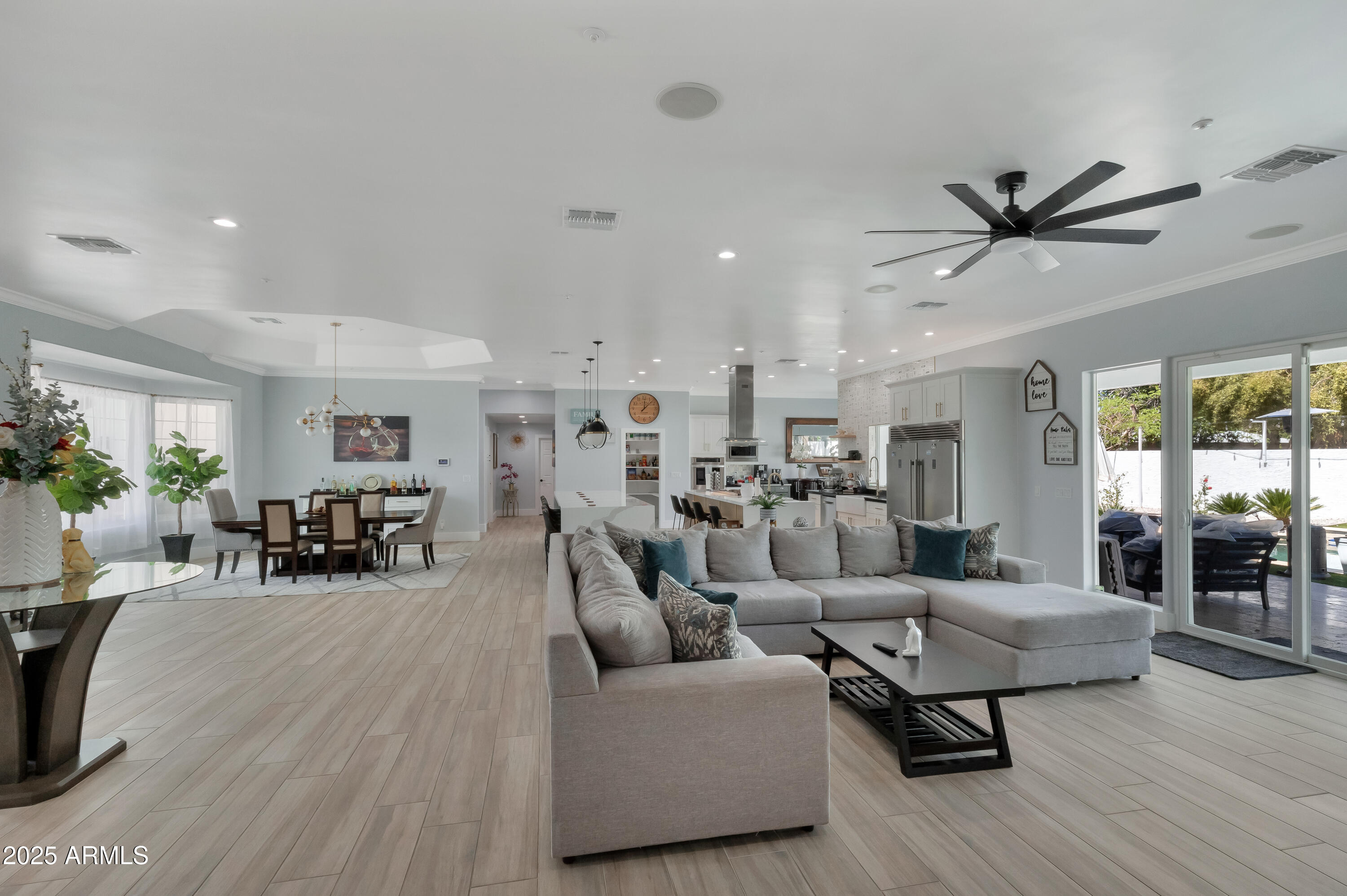 516 West Rancho Drive Phoenix, AZ 85013 - Photo 5 of 46 a living room with furniture and a dining table with wooden floor