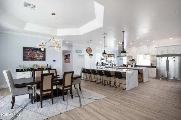 a view of kitchen with cabinets and wooden floor