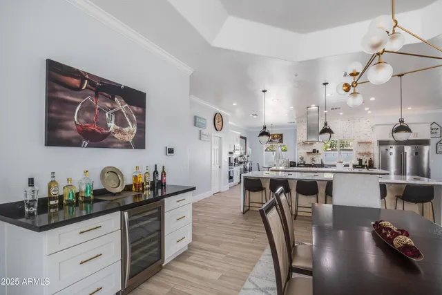 a large kitchen with a table and chairs in it