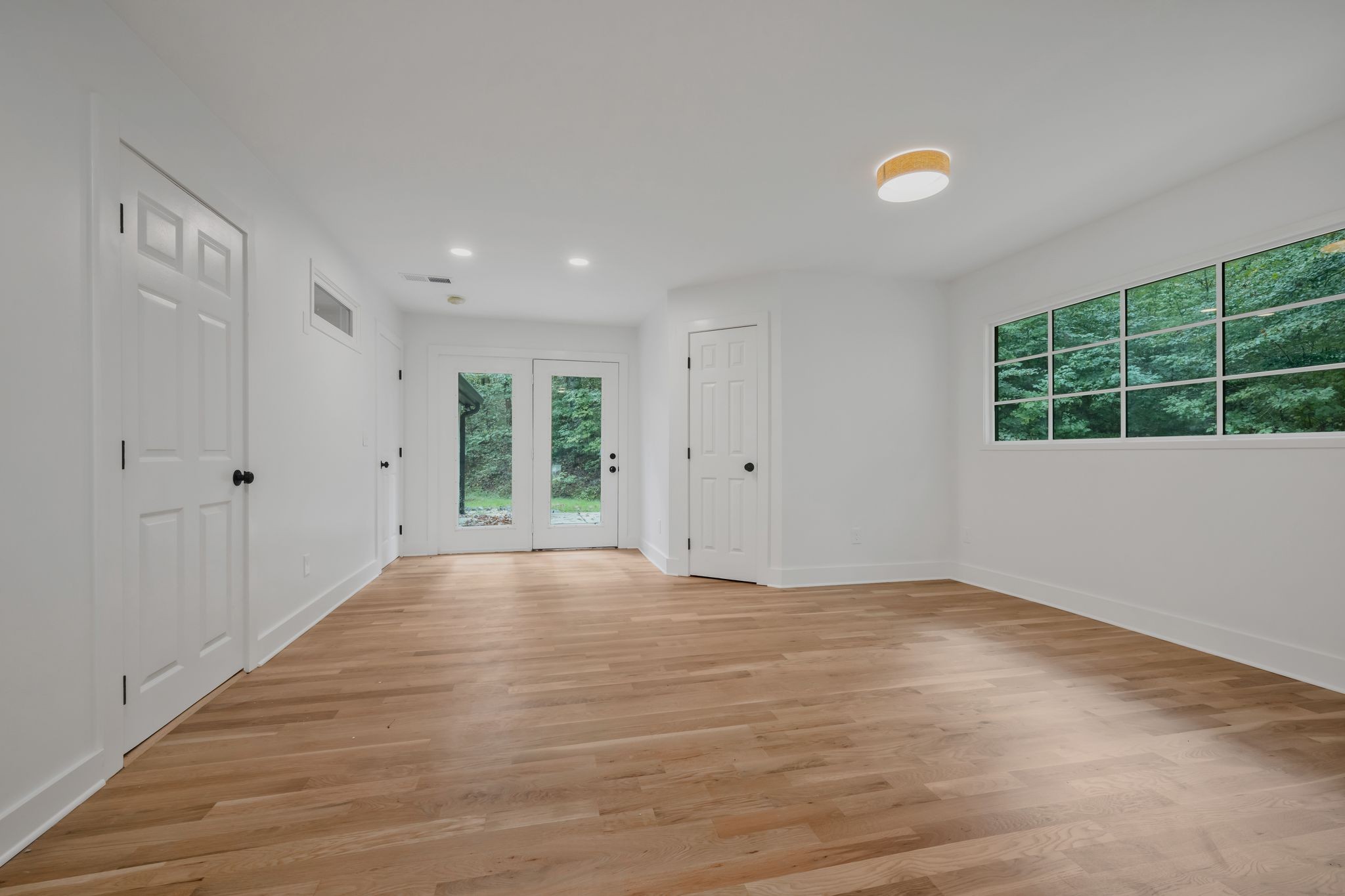 1032 Paint Pony Trail Pegram, TN 37143 - Photo 13 of 30 a view of an empty room with wooden floor and a window