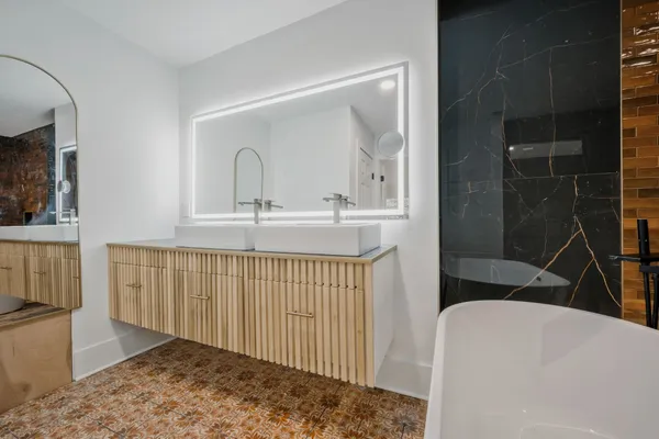 a bathroom with a sink and a mirror