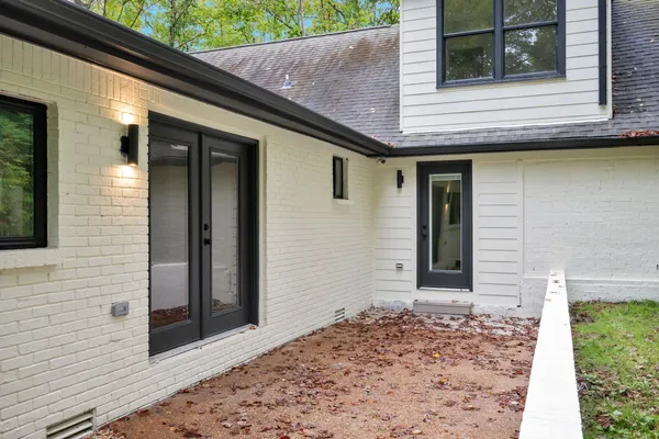 a brick house with a large windows
