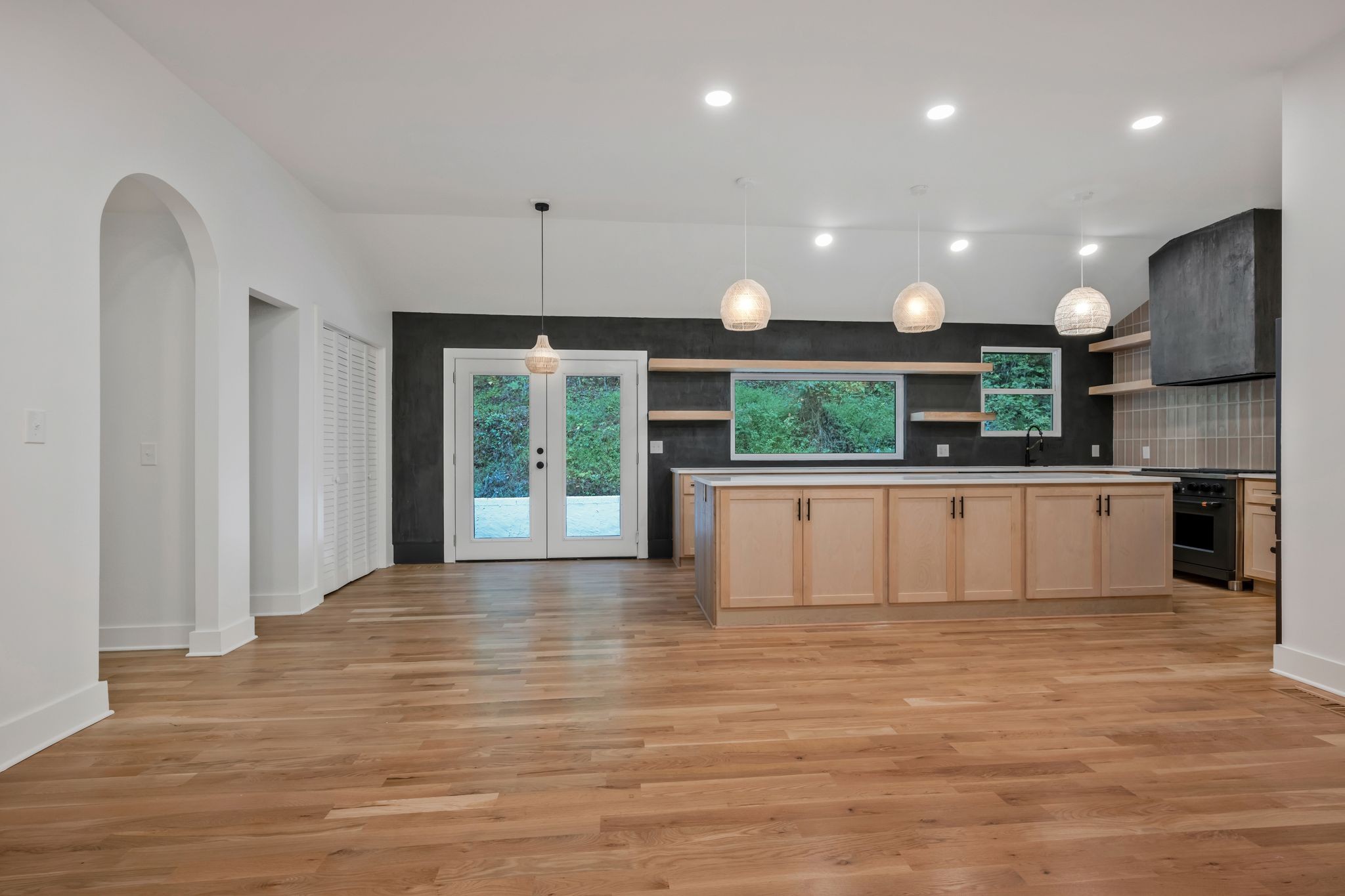 1032 Paint Pony Trail Pegram, TN 37143 - Photo 5 of 30 a large kitchen with stainless steel appliances granite countertop a large counter top a stove and a sink