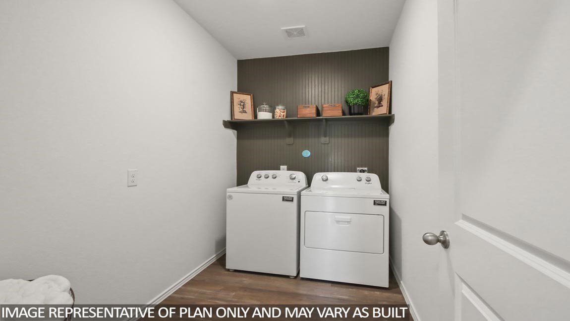 1711 Portia Lane Conroe, TX 77301 - Photo 16 of 26 a utility room with dryer and washer