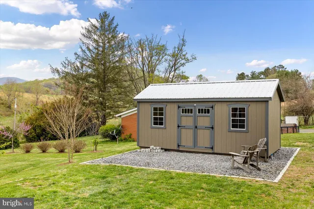 a kitchen with stainless steel appliances a stove sink microwave and cabinets