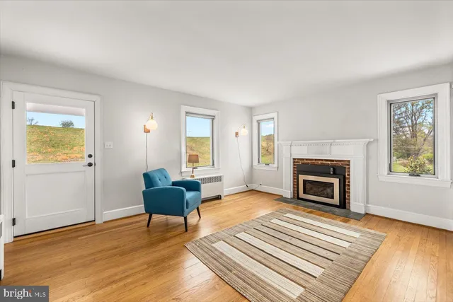 a living room with furniture flat screen tv and a fireplace