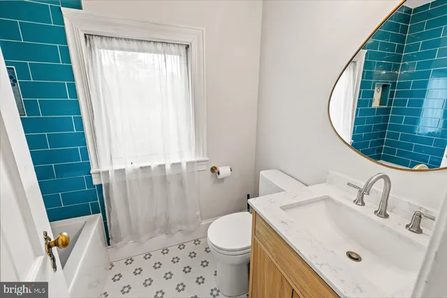 a view of a room with wooden floor and windows