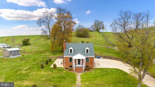 a view of a lake with a house in the background