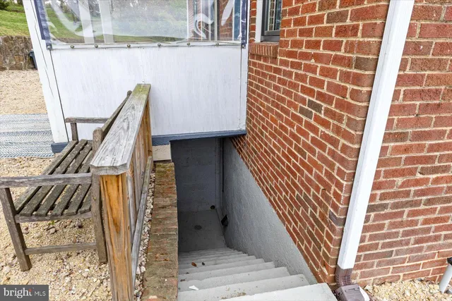 a view of a yard with wooden fence