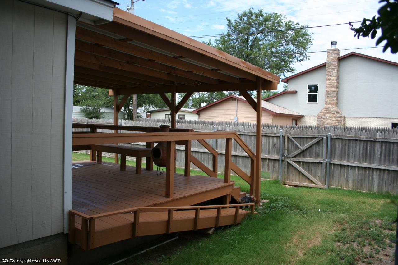 4104 Bowie Street Amarillo, TX 79110 - Photo 16 of 18 a view of backyard with deck and outdoor seating