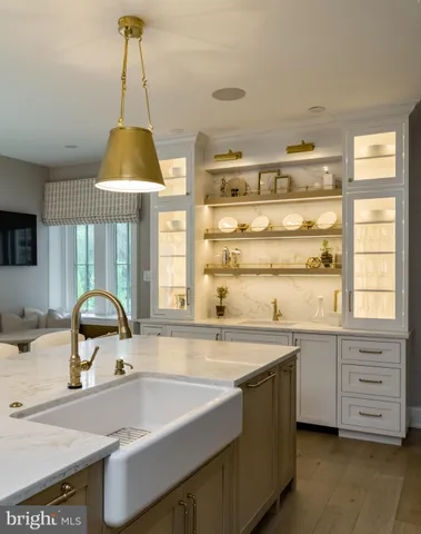 a kitchen with stainless steel appliances granite countertop a stove and a refrigerator