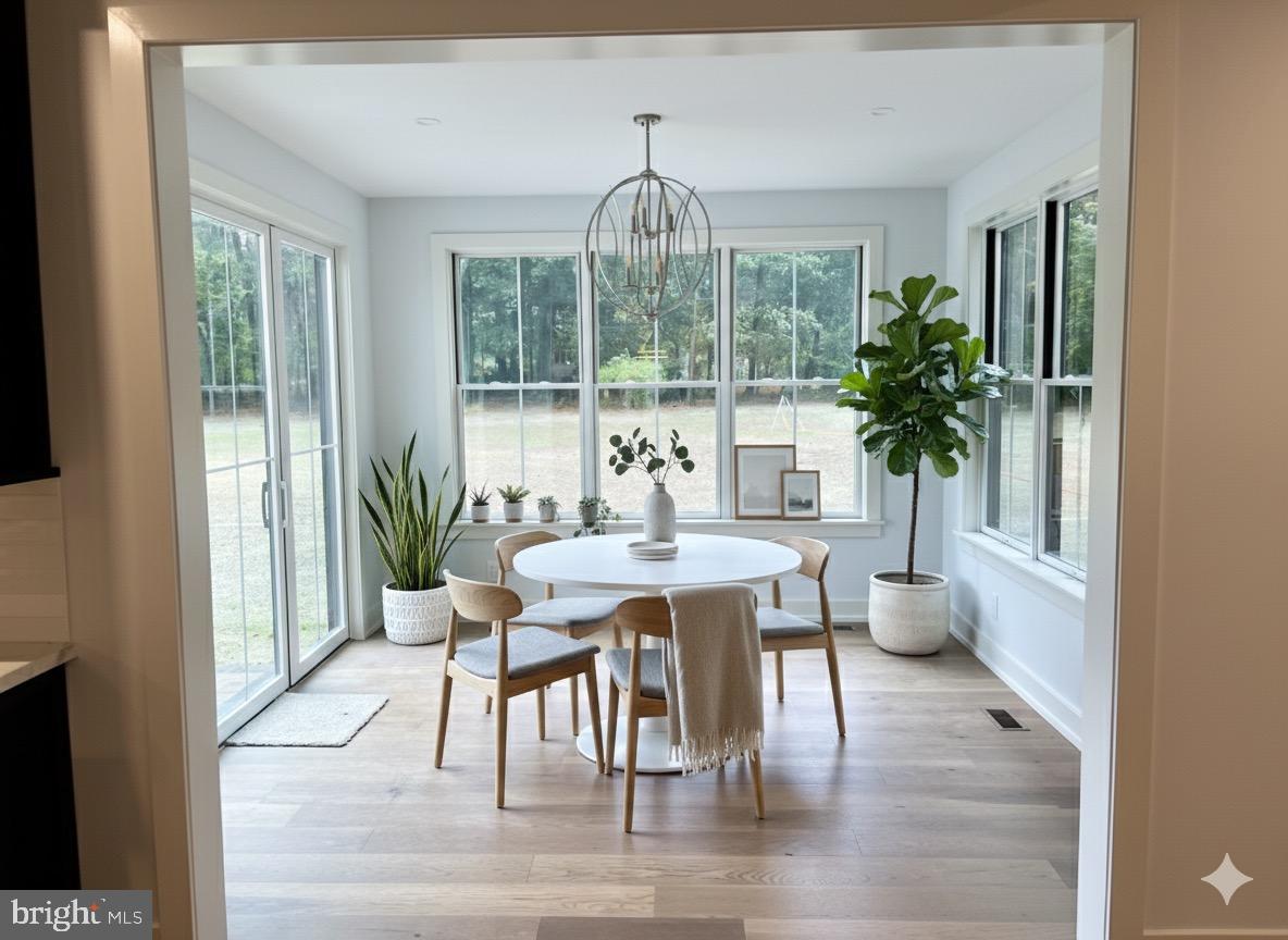 0 Prescott Road Berwyn, PA 19312 - Photo 18 of 30 a dining room with furniture wooden floor and a chandelier