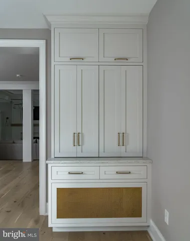 a kitchen with cabinets and window