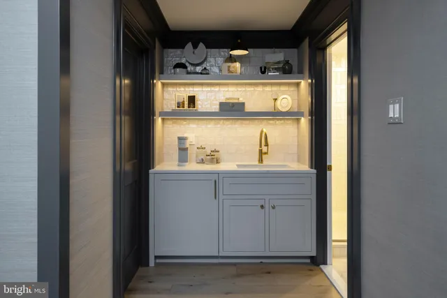 a utility room with sink dryer and washer