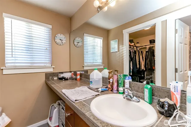 a white toilet sitting next to a shower curtain