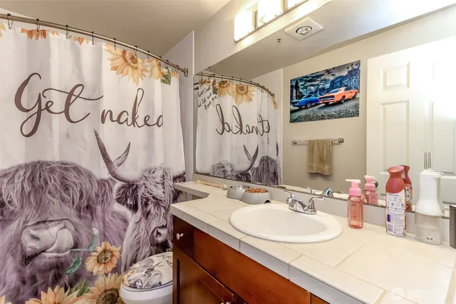 a bedroom with a bed and a mirror