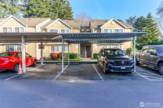a view of a car parked in front of a house