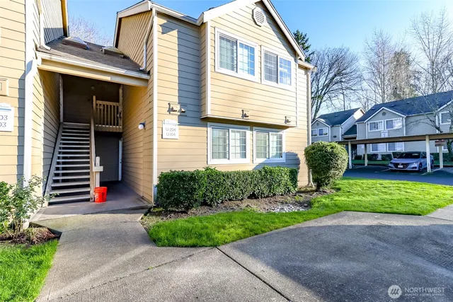 a front view of a house with a yard and outdoor space