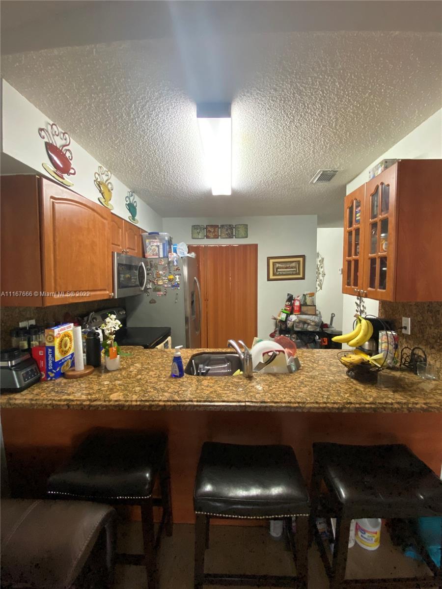 2879 West 75th Terrace Hialeah, FL 33018 - Photo 5 of 16 a view of a dining room with furniture