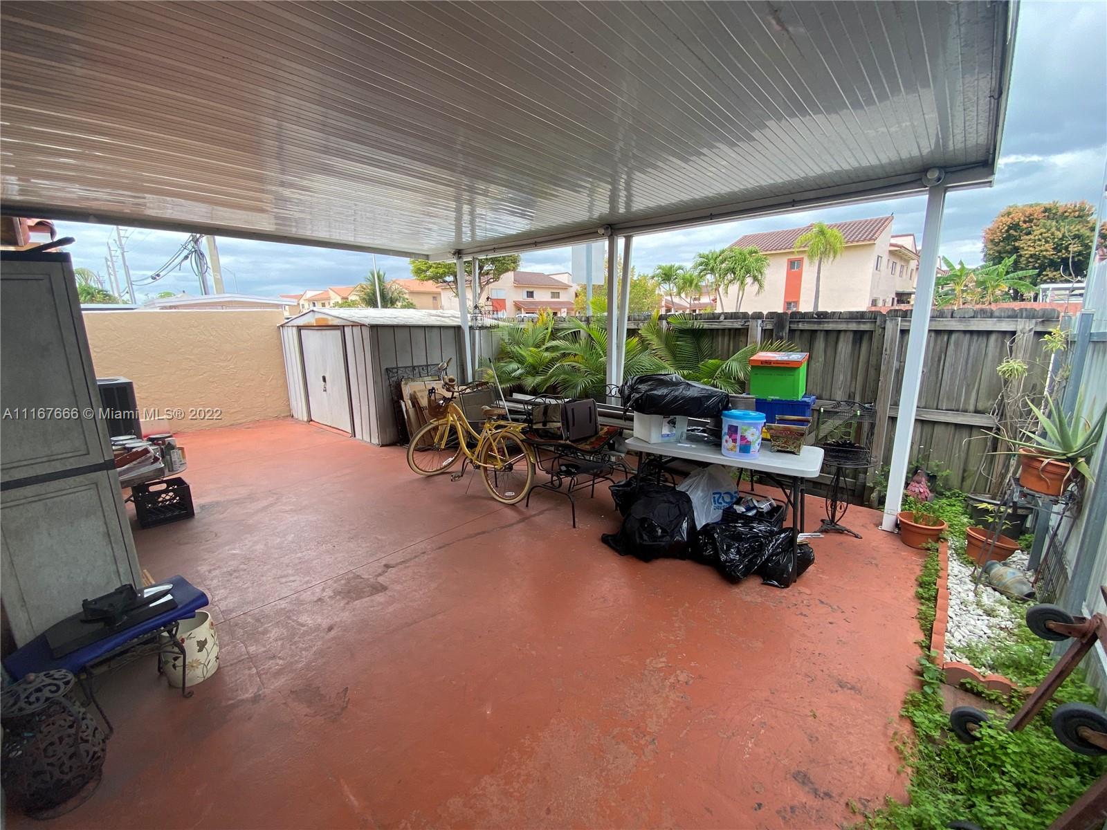 2879 West 75th Terrace Hialeah, FL 33018 - Photo 7 of 16 a room with gym equipment and a large window