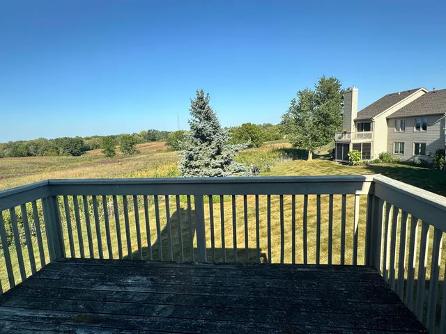 a kitchen with kitchen island white cabinets and stainless steel appliances