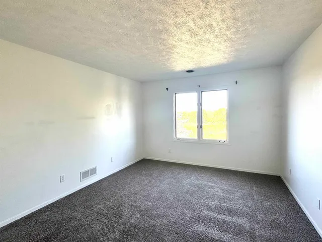 a bathroom with a double vanity sink toilet mirror and bathtub