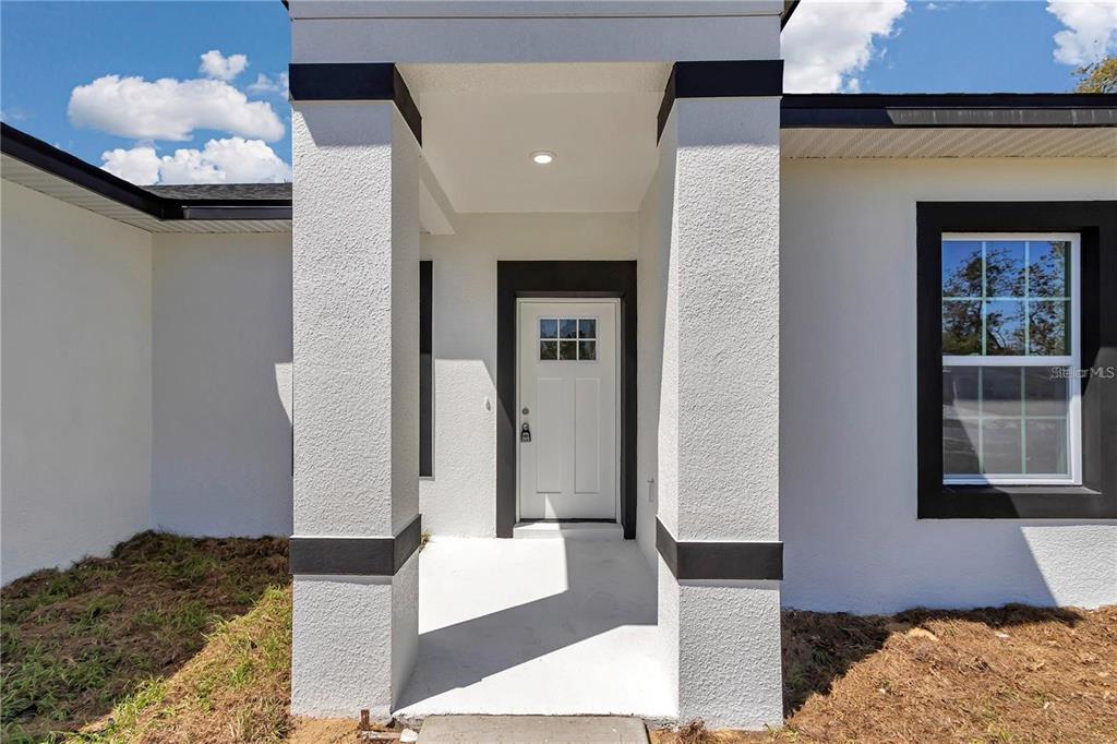 3875 Southwest 169th Ln Road Ocala, FL 34473 - Photo 11 of 46 a bedroom with a bed and a window