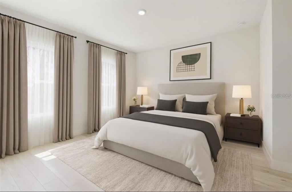 3875 Southwest 169th Ln Road Ocala, FL 34473 - Photo 14 of 46 a bedroom with a bed and a window